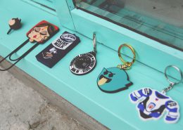 A collection of keychains on a windowsill.