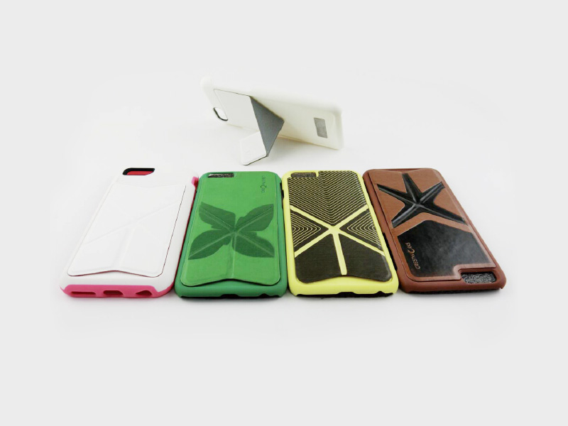 A set of phone cases in different colors on a white surface.