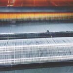 A machine producing large quantities of fabric.