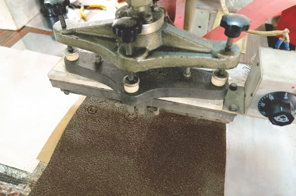 A machine used to manufacture leather.